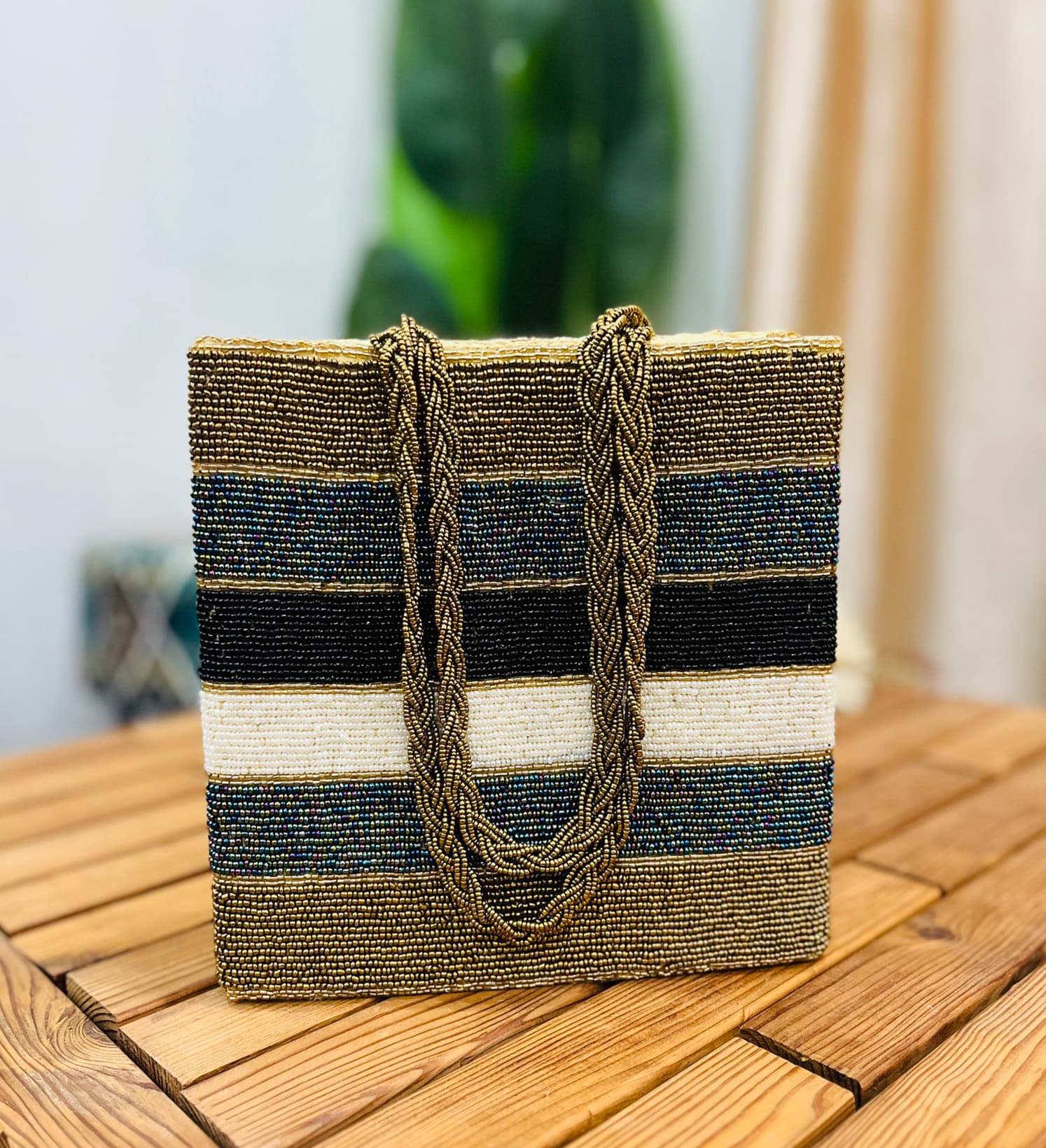 Metallic striped tote bag with hand-beaded design, featuring a mix of gold and silver beads, black handles, by Zara Label.